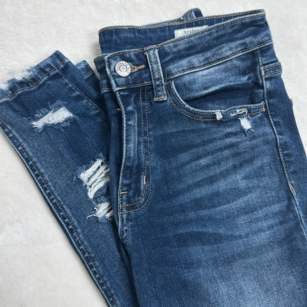 Buckle Mid Rise Ankle Skinny Jeans